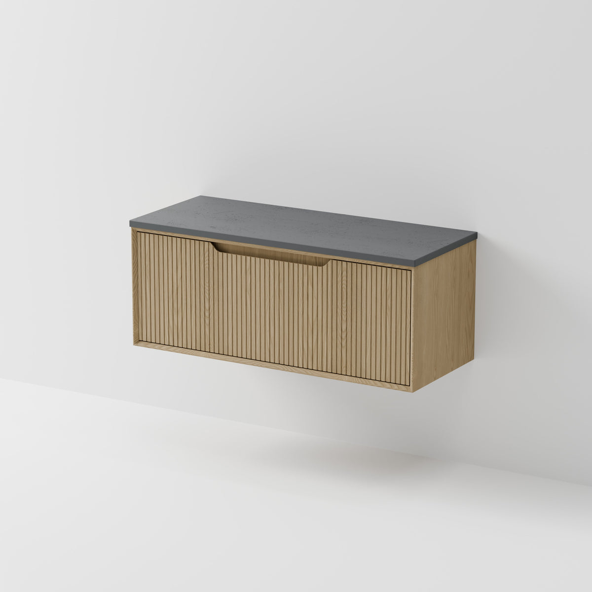 Aria 1200 wall hung vanity with vertical grooved drawer and concrete slab top