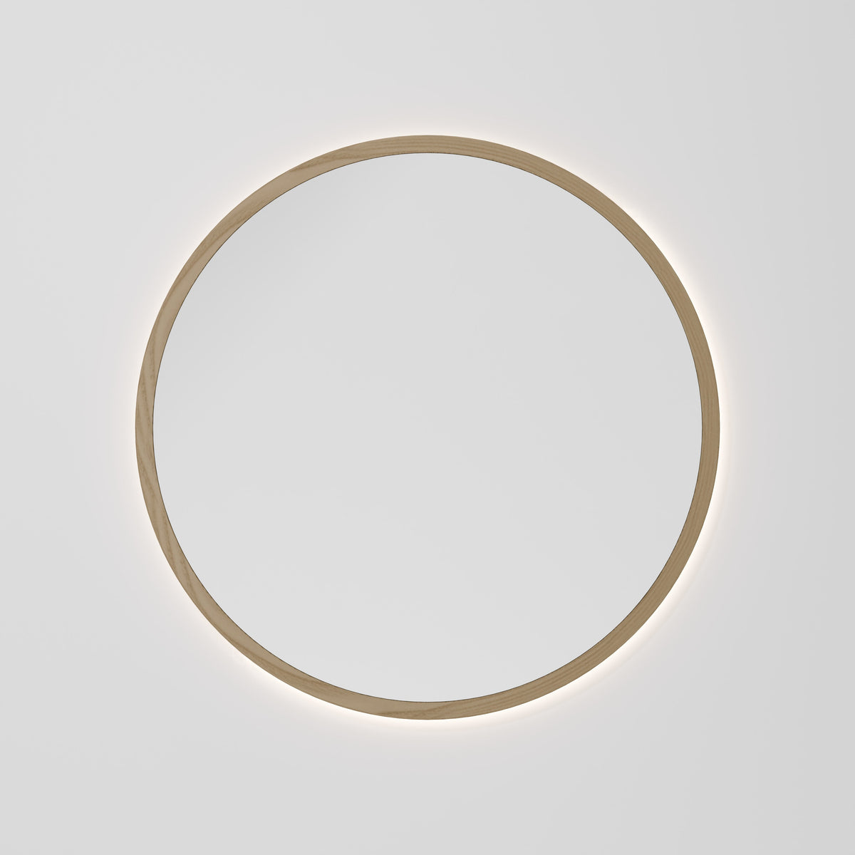 Sora round 850mm LED mirror with solid ash timber frame and warm back-light glow